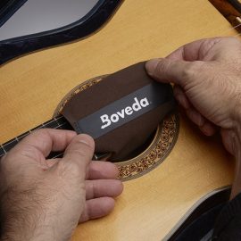 Boveda on acoustic guitar