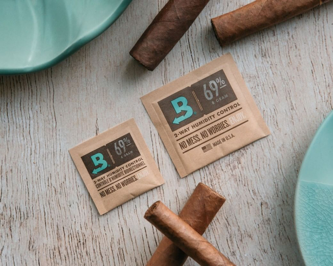 boveda packs surrounded by cigars