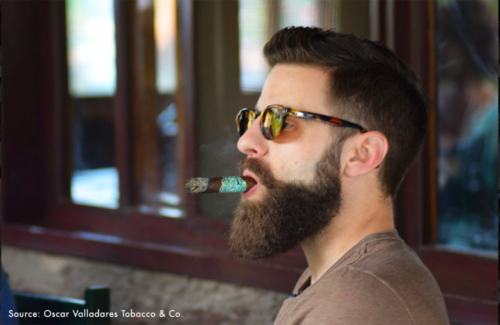 Boveda Box Press podcast host Rob Gagner enjoys an Oscar Habano during a cigar tour of Honduras through Oscar Valladares Tobacco Adventure.